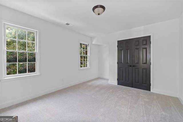 4166 Riverhill Ct, Roswell, GA 30075 - unfurnished bedroom with carpet flooring, multiple windows, and a closet