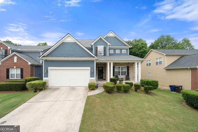 1536 Fenmore St, Lithia Springs, GA 30122 - craftsman-style home with driveway, a front yard, covered porch, stone siding, and a garage