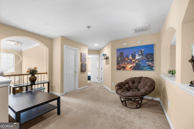 1536 Fenmore St, Lithia Springs, GA 30122 - sitting room featuring carpet flooring, a chandelier, and arched walkways