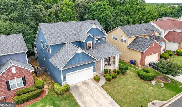 1536 Fenmore St, Lithia Springs, GA 30122 - view of front of house with a garage, driveway, board and batten siding, and roof with shingles