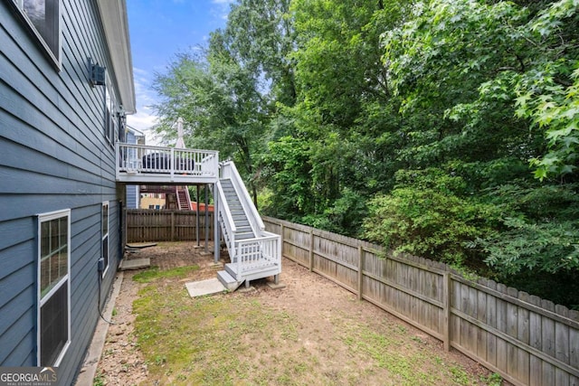1536 Fenmore St, Lithia Springs, GA 30122 - fenced backyard featuring stairs and a deck