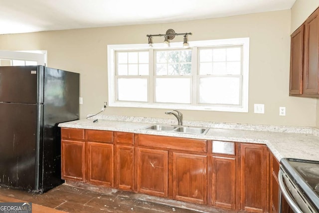 2325 E Hill Way, Norcross, GA 30071 - kitchen featuring freestanding refrigerator and brown cabinets