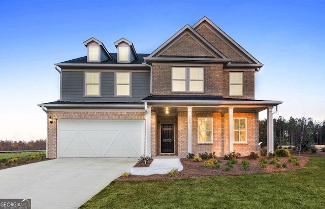 352 Foxglove Way, Mcdonough, GA 30253 - craftsman-style house featuring a garage, driveway, brick siding, a front yard, and covered porch