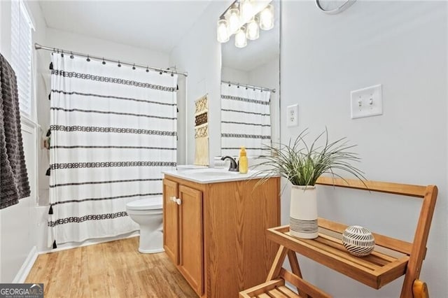 130 Nacoochee Way, Canton, GA 30114 - bathroom featuring vanity, wood finished floors, and shower / tub combo