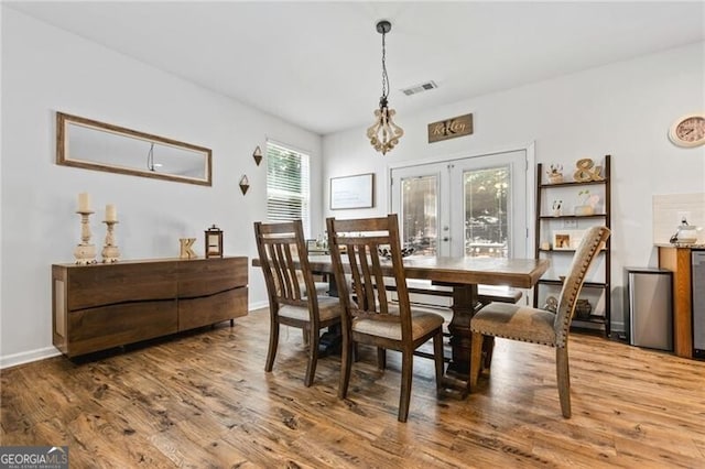 130 Nacoochee Way, Canton, GA 30114 - dining area featuring wood finished floors, french doors, and a chandelier