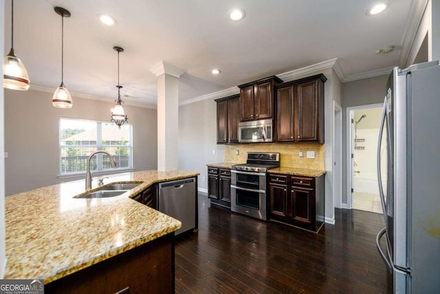 1021 Reddy Farm Rd, Grayson, GA 30017 - kitchen with appliances with stainless steel finishes, backsplash, dark brown cabinetry, light stone counters, and recessed lighting