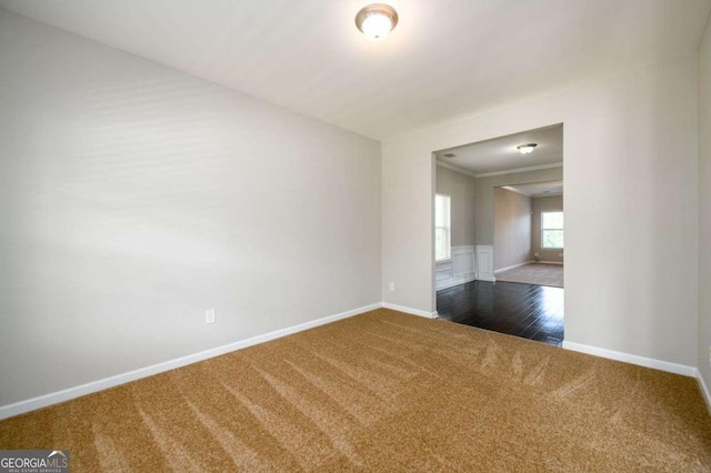 1021 Reddy Farm Rd, Grayson, GA 30017 - spare room with dark colored carpet and ornamental molding