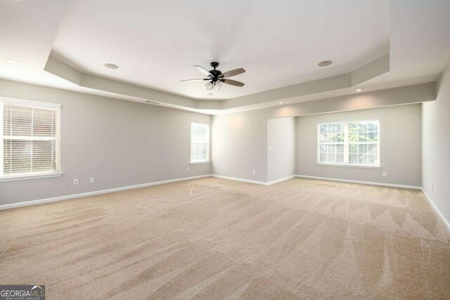 1021 Reddy Farm Rd, Grayson, GA 30017 - unfurnished room with a raised ceiling, light carpet, ceiling fan, and recessed lighting