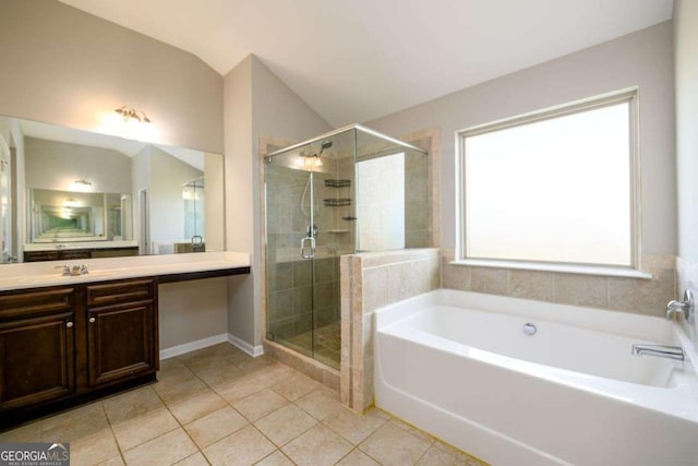 1021 Reddy Farm Rd, Grayson, GA 30017 - full bathroom with a bath, tile patterned flooring, vanity, a stall shower, and vaulted ceiling