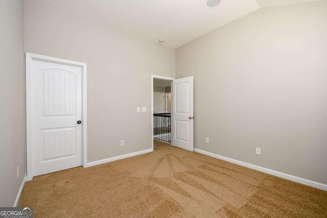 1021 Reddy Farm Rd, Grayson, GA 30017 - unfurnished bedroom with carpet and vaulted ceiling