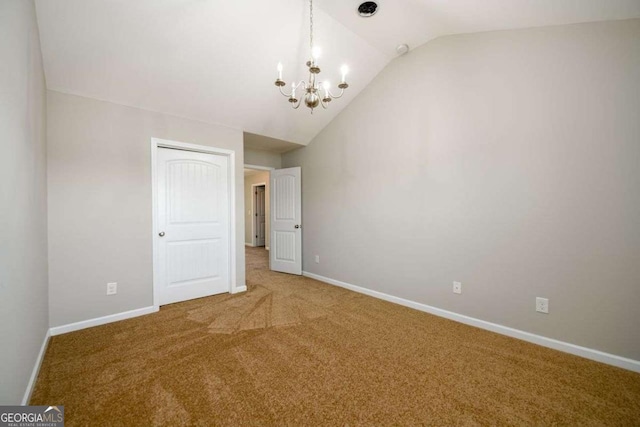 1021 Reddy Farm Rd, Grayson, GA 30017 - carpeted empty room with lofted ceiling and a chandelier