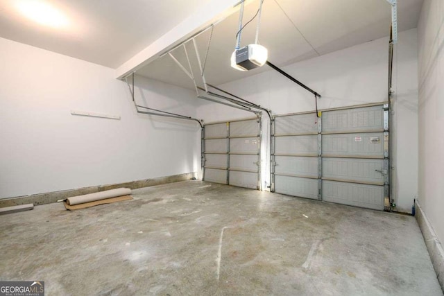 1021 Reddy Farm Rd, Grayson, GA 30017 - garage with a garage door opener and baseboards