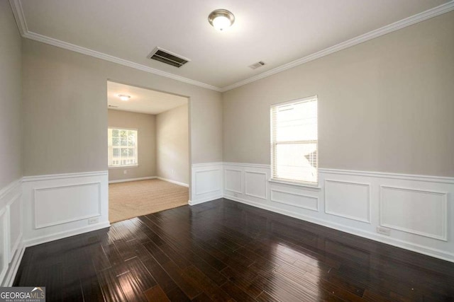 1021 Reddy Farm Rd, Grayson, GA 30017 - spare room with wainscoting, dark wood-style floors, and crown molding