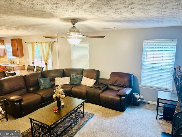 789 Winbrook Dr Unit 1, Mcdonough, GA 30253 - living area with light carpet, a ceiling fan, and a textured ceiling