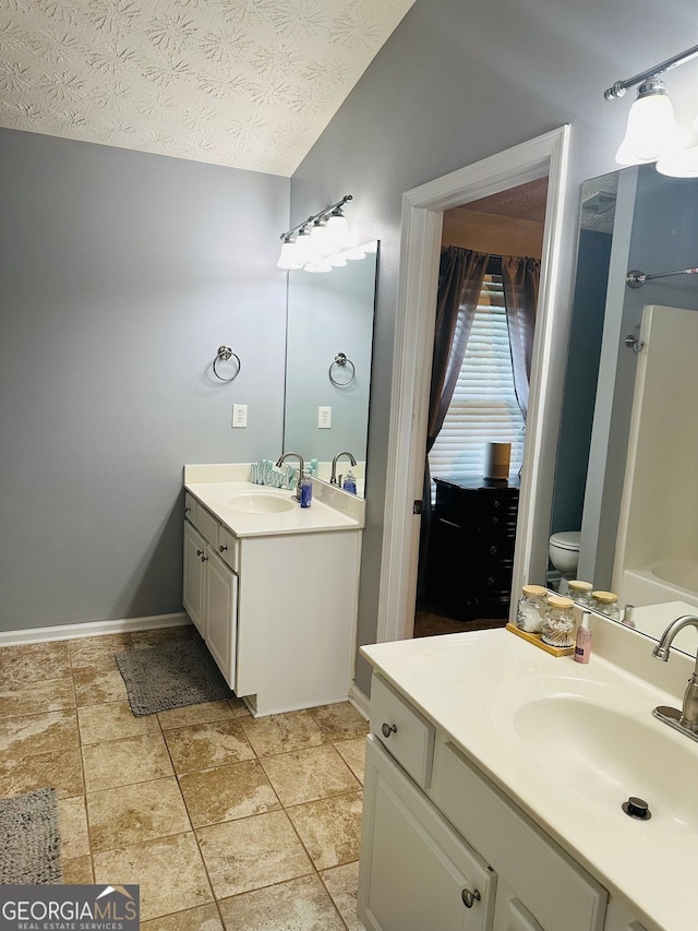 789 Winbrook Dr Unit 1, Mcdonough, GA 30253 - bathroom with vanity and a textured ceiling
