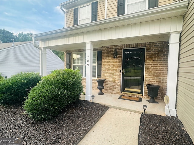 789 Winbrook Dr Unit 1, Mcdonough, GA 30253 - entrance to property with covered porch and brick siding
