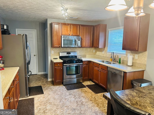 789 Winbrook Dr Unit 1, Mcdonough, GA 30253 - kitchen featuring stainless steel appliances, backsplash, brown cabinetry, and light flooring