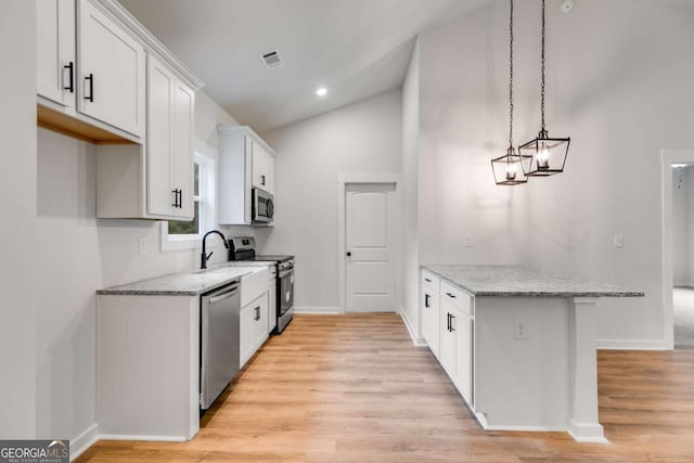 560 Coots Lake Rd, Rockmart, GA 30153 - kitchen featuring stainless steel appliances, light wood finished floors, a peninsula, white cabinets, and light stone counters