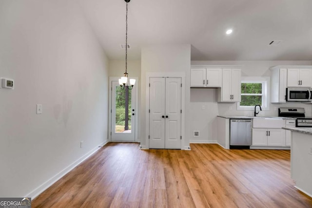 560 Coots Lake Rd, Rockmart, GA 30153 - kitchen with stainless steel appliances, light wood-type flooring, white cabinets, and recessed lighting