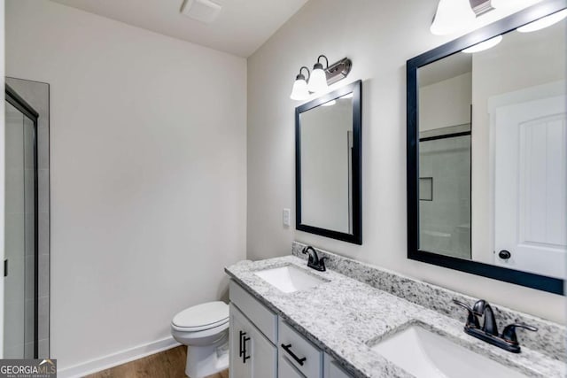 560 Coots Lake Rd, Rockmart, GA 30153 - full bathroom with double vanity, wood finished floors, and a shower with door