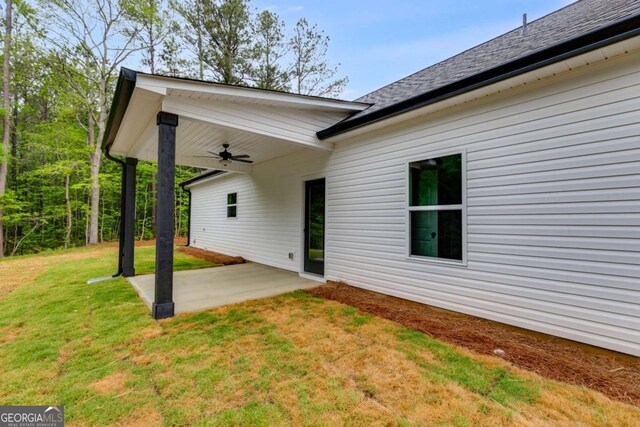 560 Coots Lake Rd, Rockmart, GA 30153 - rear view of property featuring a ceiling fan, a patio, and a lawn