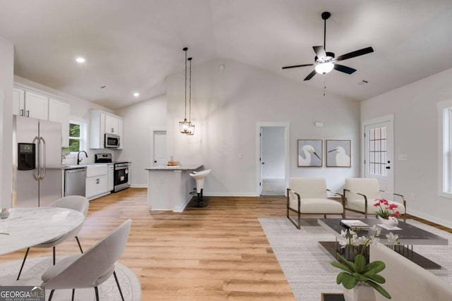 560 Coots Lake Rd, Rockmart, GA 30153 - living room featuring light wood-style floors, high vaulted ceiling, a ceiling fan, and recessed lighting