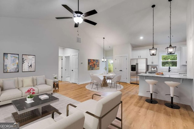 560 Coots Lake Rd, Rockmart, GA 30153 - living room with light wood-style flooring, healthy amount of natural light, ceiling fan, high vaulted ceiling, and recessed lighting