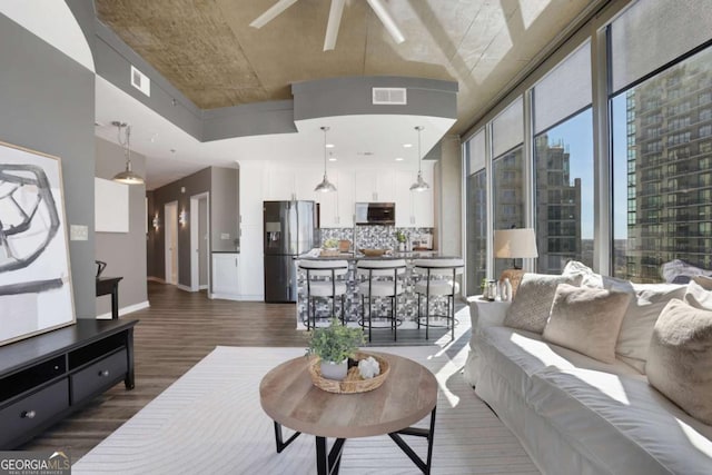 855 Peachtree St NE Unit 1703, Atlanta, GA 30308 - living room with dark wood-type flooring and ceiling fan