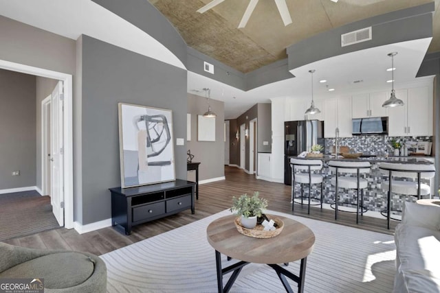 855 Peachtree St NE Unit 1703, Atlanta, GA 30308 - living room with dark wood-style flooring and a ceiling fan