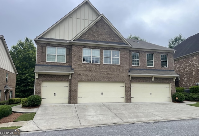 805 Pleasant Hill Rd NW Unit 53, Lilburn, GA 30047 - craftsman inspired home with board and batten siding, a garage, and brick siding