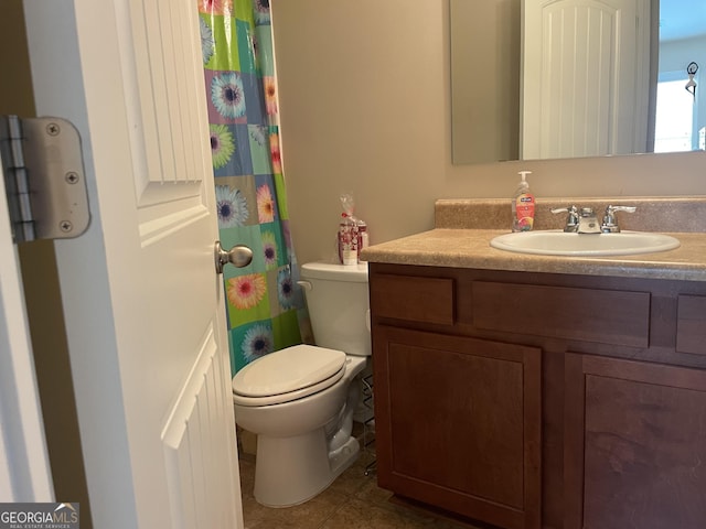 805 Pleasant Hill Rd NW Unit 53, Lilburn, GA 30047 - bathroom featuring vanity, toilet, and tile patterned flooring