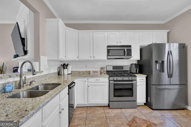 13300 Morris Rd Unit 62, Alpharetta, GA 30004 - kitchen with appliances with stainless steel finishes, a sink, white cabinetry, ornamental molding, and light stone countertops