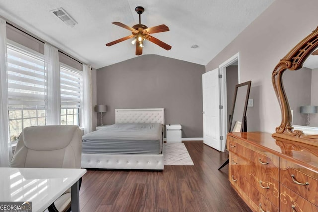 13300 Morris Rd Unit 62, Alpharetta, GA 30004 - bedroom featuring vaulted ceiling, dark wood finished floors, and a ceiling fan