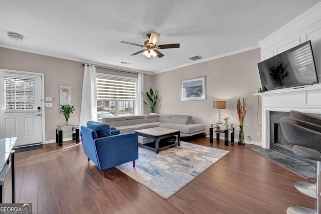 13300 Morris Rd Unit 62, Alpharetta, GA 30004 - living area with a ceiling fan, a fireplace, plenty of natural light, dark wood finished floors, and ornamental molding