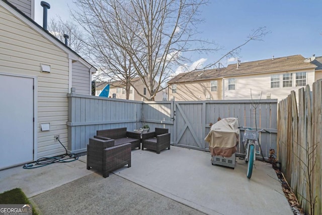 13300 Morris Rd Unit 62, Alpharetta, GA 30004 - fenced backyard with a patio, outdoor lounge area, and a gate