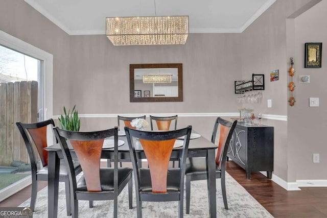 13300 Morris Rd Unit 62, Alpharetta, GA 30004 - dining room with a chandelier, wood finished floors, baseboards, and ornamental molding