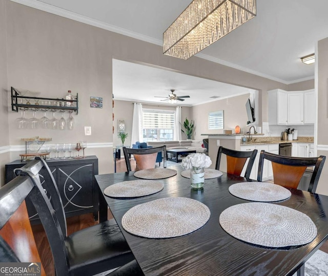 13300 Morris Rd Unit 62, Alpharetta, GA 30004 - dining area with crown molding, ceiling fan, and wood finished floors