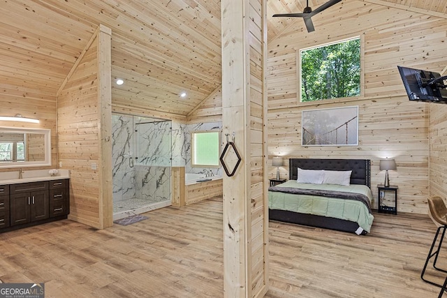 139 Maple Ridge Dr, Cleveland, GA 30528 - bedroom with wooden walls, multiple windows, high vaulted ceiling, light wood-style flooring, and recessed lighting