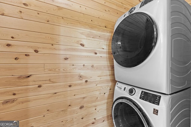 139 Maple Ridge Dr, Cleveland, GA 30528 - washroom with stacked washer / dryer and wood walls