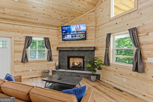 139 Maple Ridge Dr, Cleveland, GA 30528 - living room with wood walls, wood finished floors, wooden ceiling, healthy amount of natural light, and a fireplace