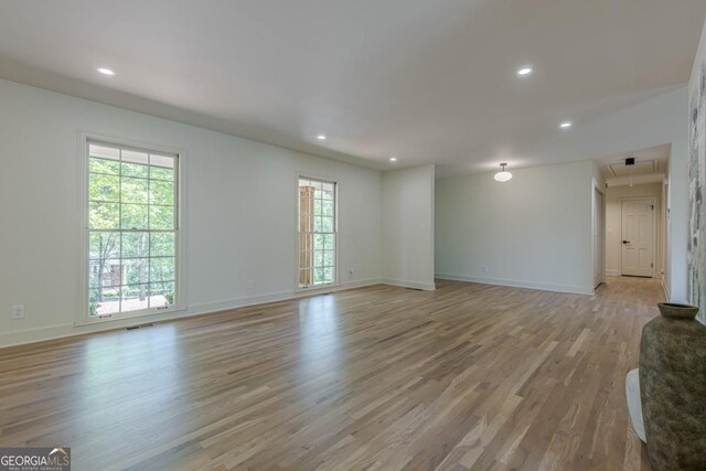 3350 Pine Meadow Rd NW, Atlanta, GA 30327 - unfurnished living room with light wood-style floors, recessed lighting, and attic access