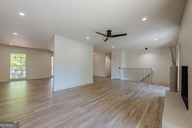 3350 Pine Meadow Rd NW, Atlanta, GA 30327 - unfurnished living room with light wood finished floors, recessed lighting, and ceiling fan