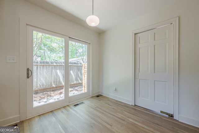 3350 Pine Meadow Rd NW, Atlanta, GA 30327 - unfurnished dining area featuring wood finished floors and baseboards
