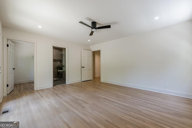 3350 Pine Meadow Rd NW, Atlanta, GA 30327 - unfurnished bedroom featuring a walk in closet, light wood-style flooring, recessed lighting, ensuite bath, and ceiling fan