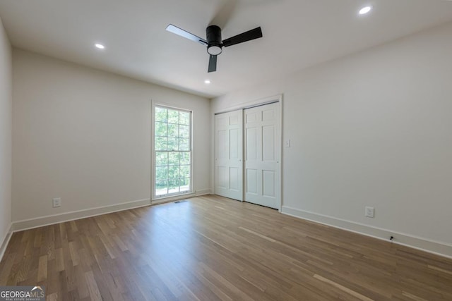 3350 Pine Meadow Rd NW, Atlanta, GA 30327 - unfurnished bedroom with wood finished floors, recessed lighting, a closet, and a ceiling fan