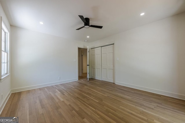 3350 Pine Meadow Rd NW, Atlanta, GA 30327 - unfurnished bedroom with light wood finished floors, a closet, ceiling fan, and recessed lighting