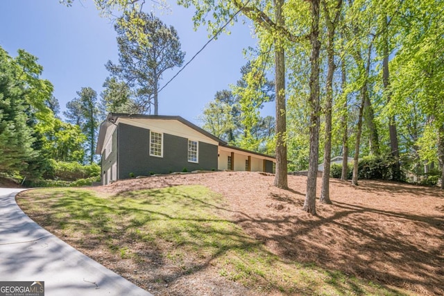 3350 Pine Meadow Rd NW, Atlanta, GA 30327 - view of home's exterior featuring brick siding