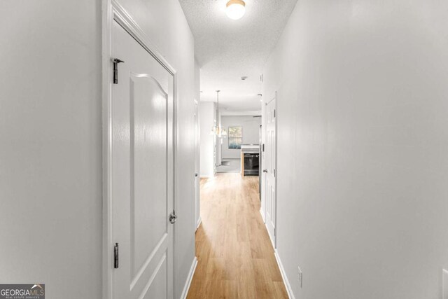 3134 Imperial Cir SW, Atlanta, GA 30311 - hall featuring light wood-type flooring and a textured ceiling