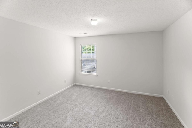 3134 Imperial Cir SW, Atlanta, GA 30311 - carpeted empty room featuring a textured ceiling and baseboards