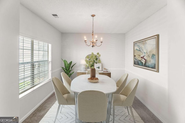 3134 Imperial Cir SW, Atlanta, GA 30311 - carpeted dining room with plenty of natural light, a chandelier, and a textured ceiling